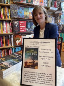Photo of Anna signing books in the Deal Bookshop
