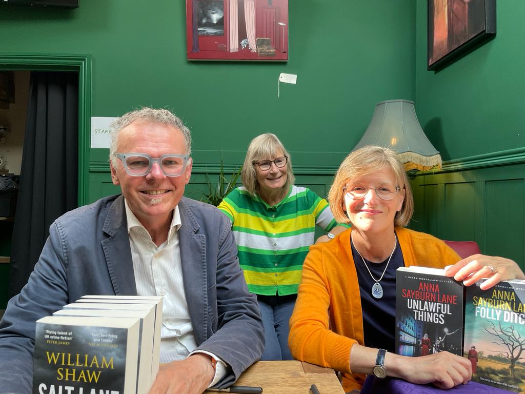 William Shaw, Amanda Holloway and Anna Sayburn Lane sign books after the event.